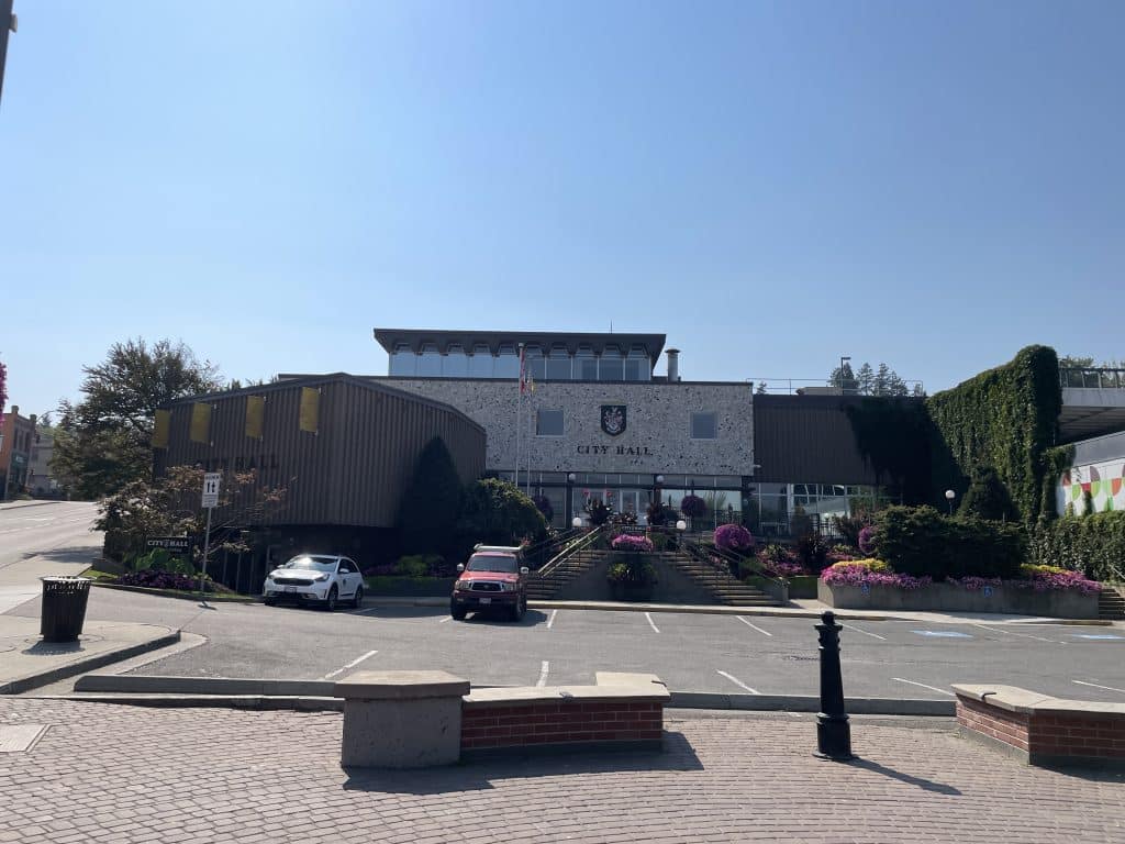 A photo of City Hall in the summer where municipal government makes several decisions.