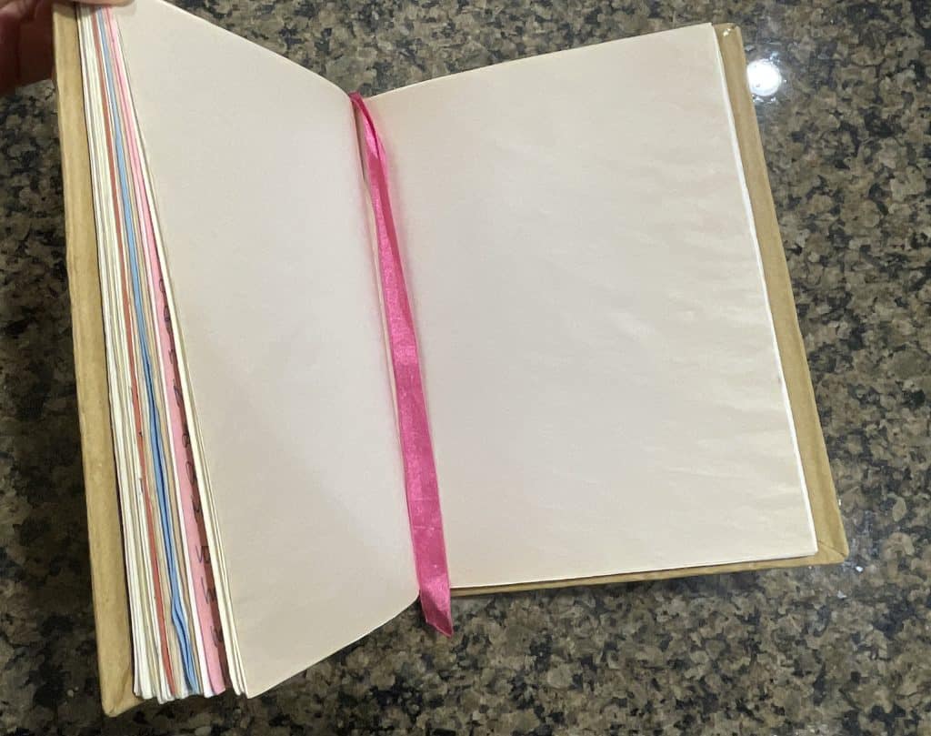A notebook with various colour pages which were upcycled. A great present someone can do themselves. 